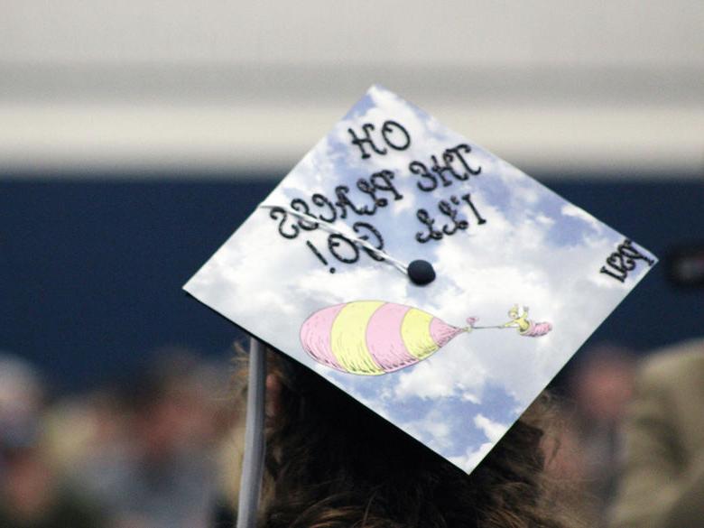 A Penn State Mont Alto grad dons a decorated mortar board at commencement